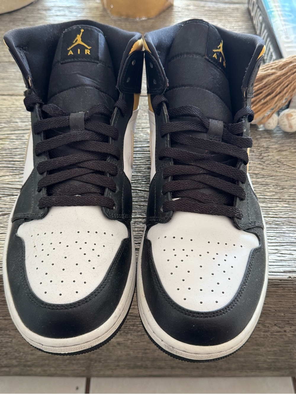 Nike Black and White Air Jordan 1 High Sneaker with Gold Accents